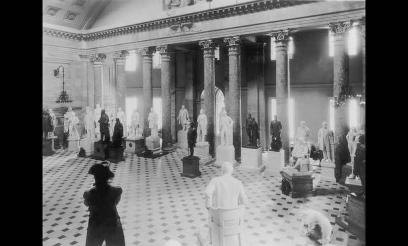 The National Statuary Hall in 1932 from the Prints and Photographs Division of the Library of Congress. Since the hall was crowded at this time, some statues were placed in other locations in the Capitol. 