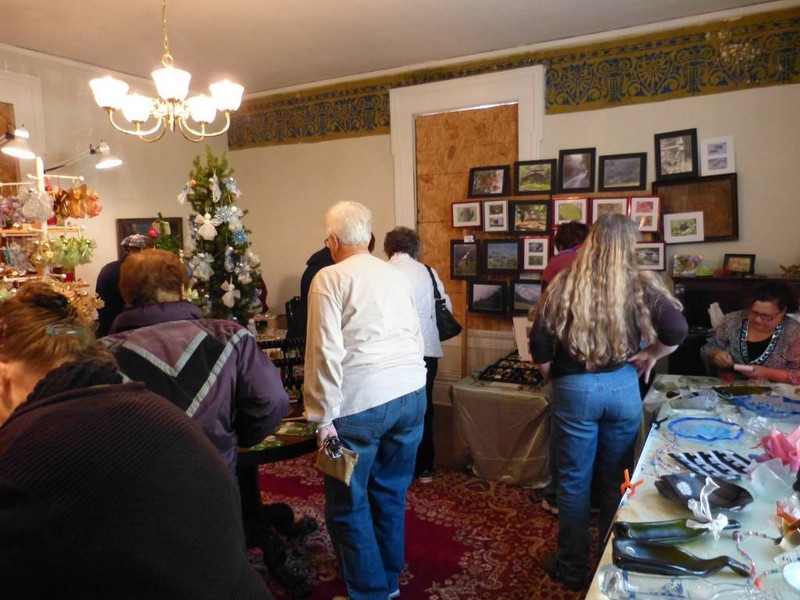 A fundraising event inside the house. Notice the stencil work on the wall.