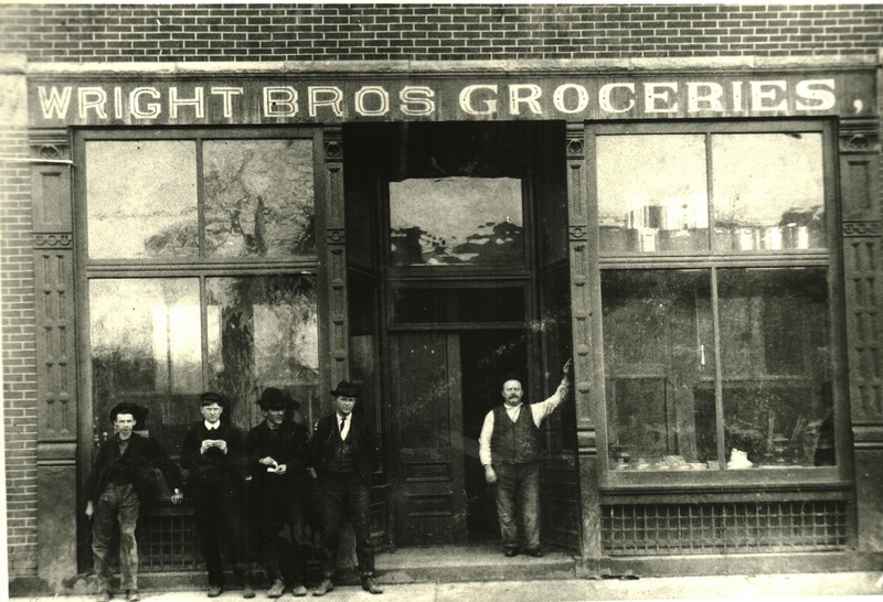 Wright Brothers storefront. In addition to groceries, the business sold dry goods, clothing, paint, wallpaper, and other products. 