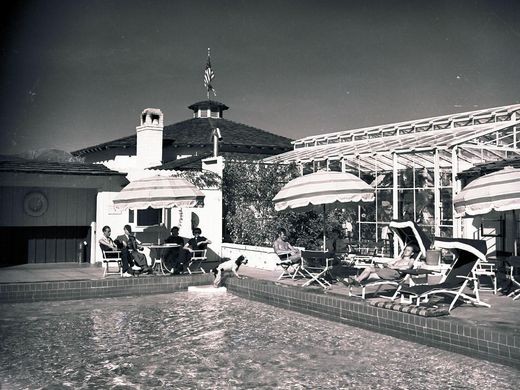 Visitors lounging by the pool at the Racquet Club, ca. early 1940s. 