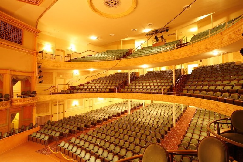 The fully renovated auditorium glows under its new lighting.