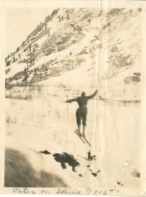 Peter Prestrud, jumping at Excelsior Mine with Mt. Royal in the background