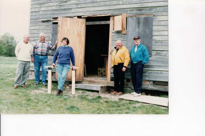 The Gandy House in its early stages of restoration. @1980 The members of the restoration crew are from left to right:James Siegrist, Paul Kuhnle, Sonia Forry, and Reynolds Schmidt.