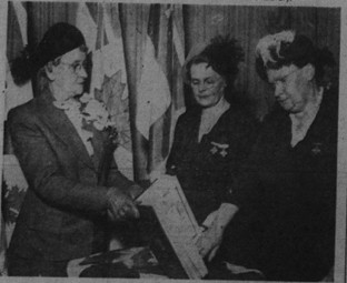 Mrs. E. M. Harding, left, president of the London Chapter, Silver Cross Women of Canada, holds the “Book of Remembrance” for members, Mrs. Florence Smith, Byron, and Mrs. Peter Fay, right, of London. (Taken from London Free Press caption)