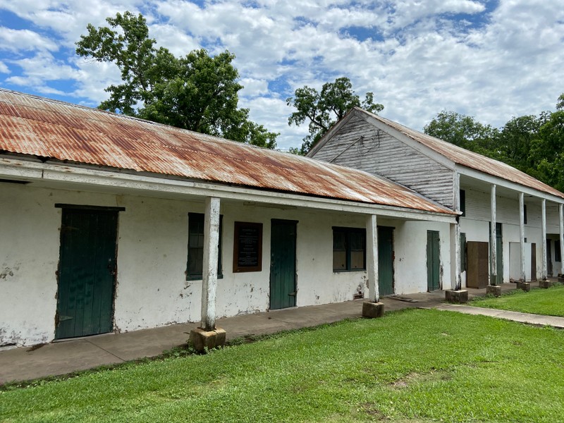 In 1834, the first brick dwellings were constructed for the enslaved persons at the Academy. These quarters are still in existence and now bear a plaque listing the known names of the families and individuals who resided there.