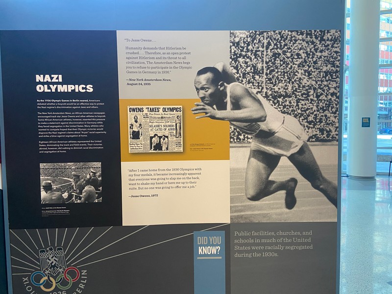 A black and white image of Jesse Owens at the Olympic games.