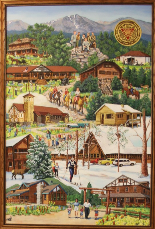 The painting shows a collage of recognizable buildings on YMCA of the Rockies property. From top to bottom, the original Wind River Lodge, the Administration Building, Mountainside Lodge, Hyde Chapel, a cabin, two lodges, a reunion cabin, and the Lula W. Dorsey Museum are depicted among the green pine trees and surrounding natural environment. Guests are shown in between the buildings enjoying various activities from YMCA of the Rockies' 100 years like hiking, skiing, and horseback riding. Three, gray mountain peaks sit in the background. Mt. Ypsilon is in the center, with its snow-covered "Y" in the side of the mountain