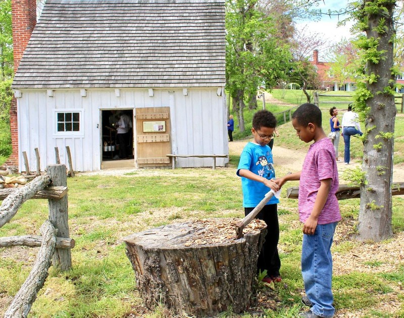 Families explore Sotterley's c.1830 slave cabin. 