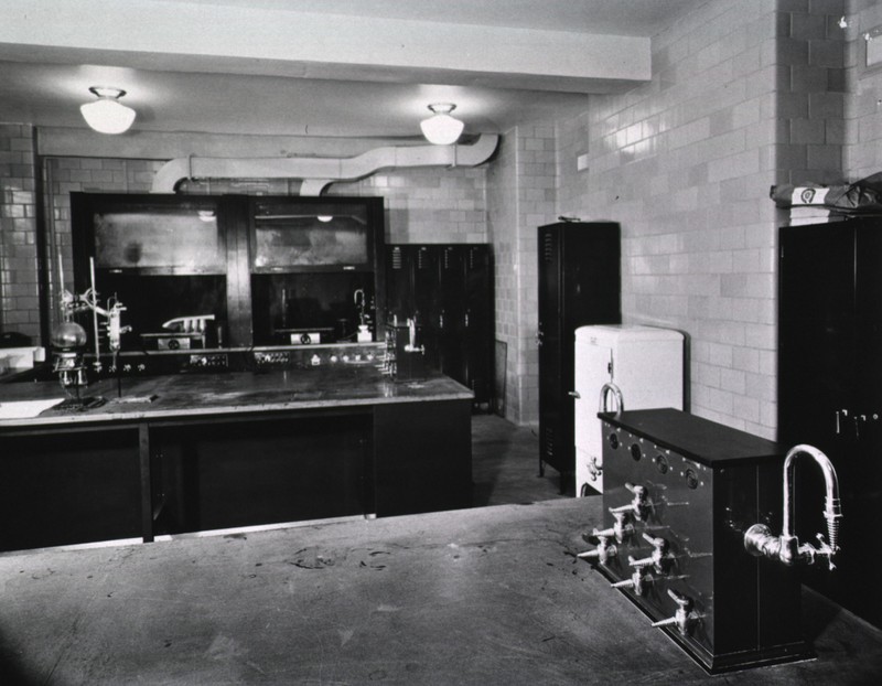 c. 1938. Laboratories in Building 2 were state-of-the-art for the time. Note the fume hoods and exhaust pipes in the background.  The valves in the foreground gave researchers easy access to gas, water, and compressed air. 