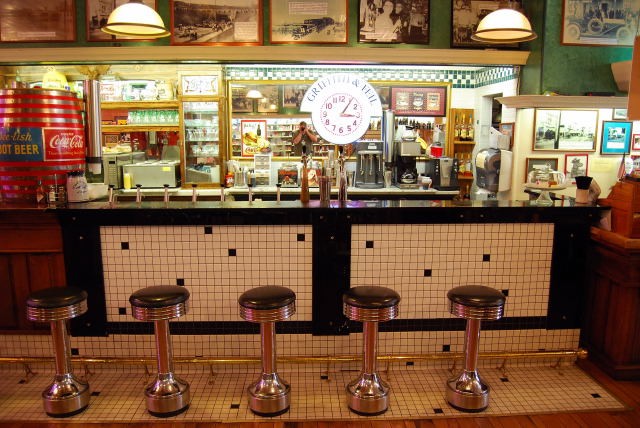 Here you can see the counter and up along the wall you can see pictures of events from our local history.