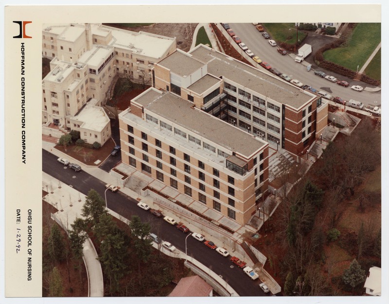 Color photograph of the OHSU School of Nursing building, aerial view, depicts a u-shaped building of six stories surrounding a courtyard.