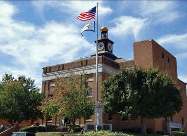 The fifth and current Wayne County Courthouse was built in 1923; newer additions were added in later years.