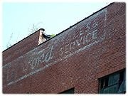 Formerly a Ford dealership, you can view the advertisement painted on the building that was removed during preservation.