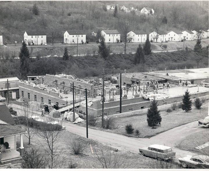 Image of Stadium Terrace Housing in the background during building of U.S. Mine Safety and Health Administration building.  