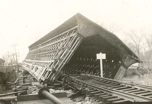 Image of the covered railroad bridge in Contoocook during high waters.