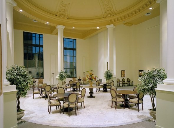 The former bank's main lobby now provides dining space for the building's residents. Notice the original 32-foot dome above the dining tables.