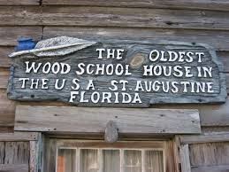 Sign posted on entrance of schoolhouse