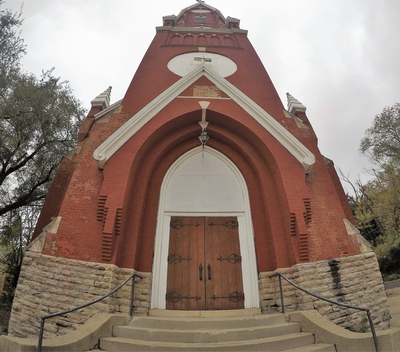 The ornate wooden doors are the only exterior opening that has not been covered with plywood. (Photo taken by Bradley Cutter on 11/2/2018)