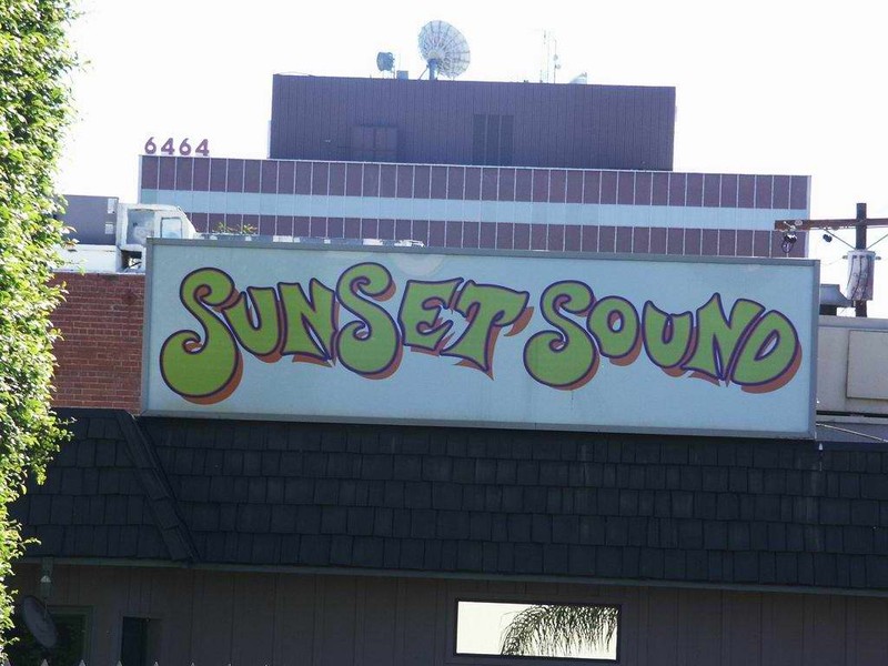 Sunset Sound sign view from parking lot. 
