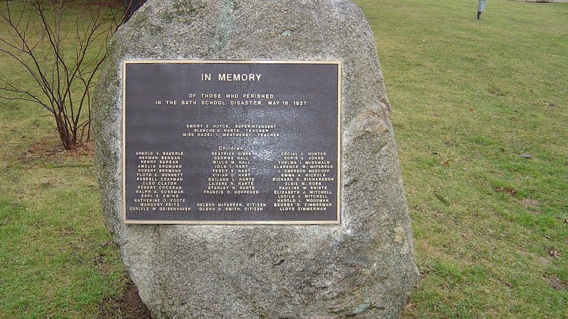 Memorial rock located where Bath School's north wing stood, with a plaque dedicated to those who died