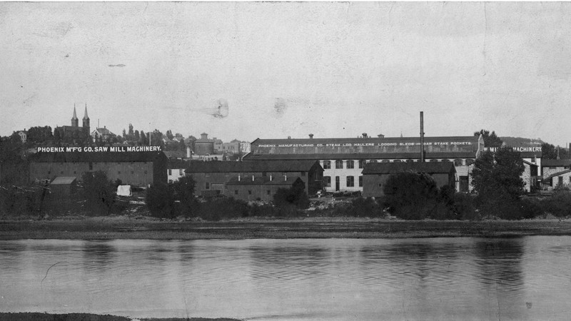 View of Phoenix Manufacturing buildings from west side of Chippewa River (ca. 1907-1925)
