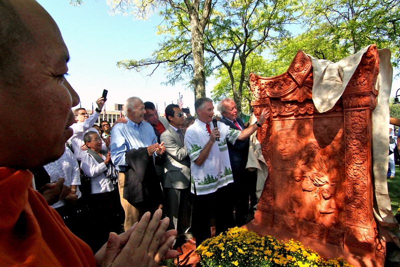 "A Buddhist Monk watches on left as Lowell City Councilor Rodney Elliott, along with other councilors and Mayor Ed Kennedy unveils the Khmer Monument in front of Lowell City Hall."
THE SUN Photo by David H. Brow