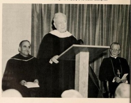 Fr. Michael McInerney receiving a honorary doctorate from St. Vincent's College following the construction of the Library, recognizing his architectural contributions to over 200 buildings and structures. Source: The Spire Yearbook, 1959.