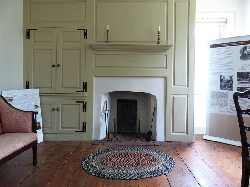 One of the first floor rooms with small fireplace.