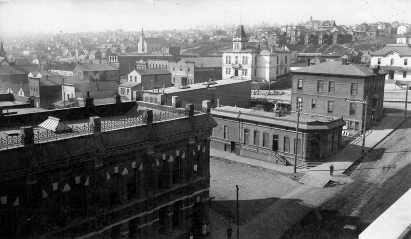 View of 9th & Broadway, circa 1885.  White building in upper part of image is Pierce County Courthouse.