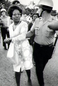 Clara Luper is pictured here being restrained by a police officer at one of the many demonstrations that she was a part of. 