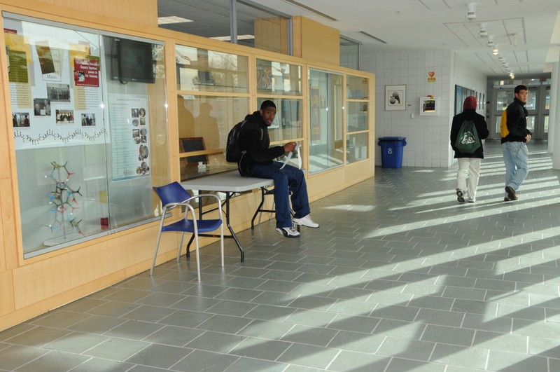 Student and Display Case in Henson Hall