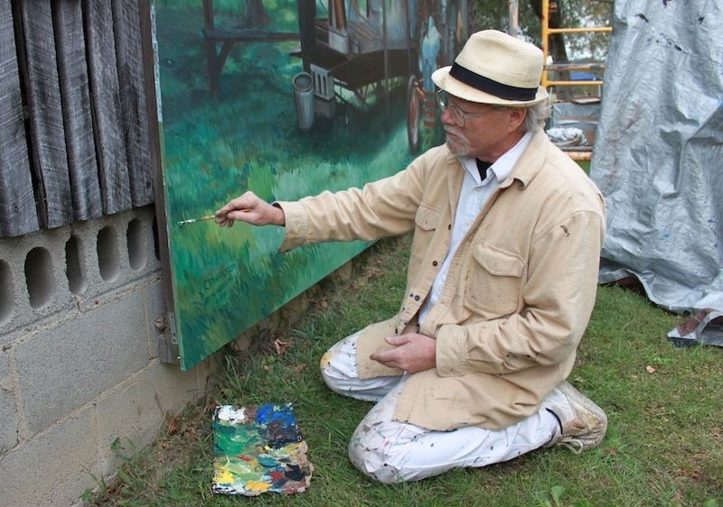 Artist Robert Dafford painting the Portsmouth Floodwall