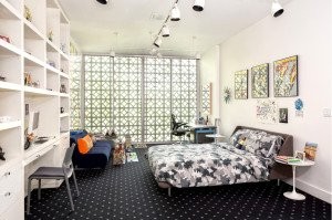 A bedroom with both privacy and natural lighting in Stone House.