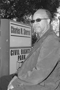 The Rev Charles Sherrod standing in front of the entrance of the Civil Rights park .