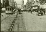 A screenshot of the film around present-day 7th and Market, near the present day BART station