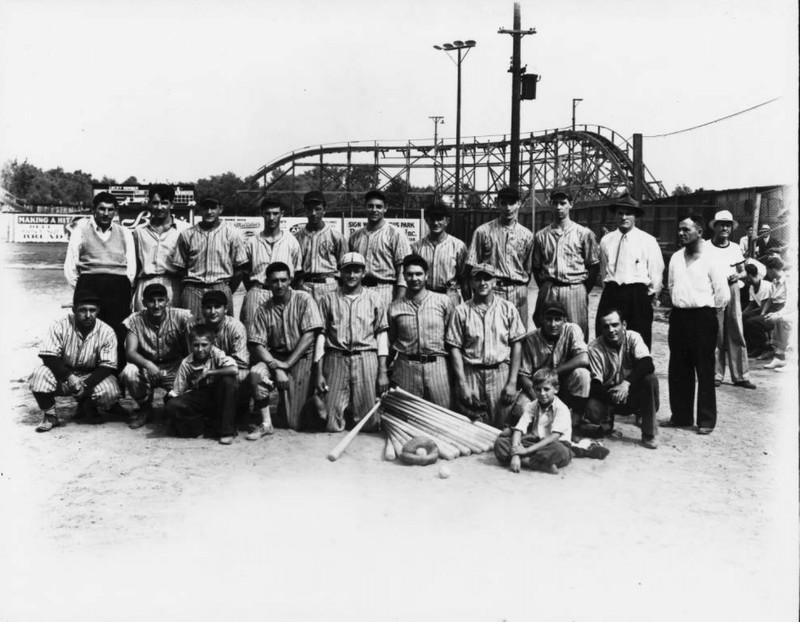 Youngstown Sheet and Tube Company employees before a baseball game at Idora Park on Labor Day in 1939. The Jack Rabbit roller coaster is visible in the background.