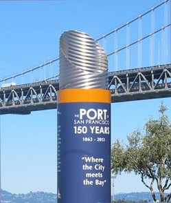 One of the cylindrical historical markers, which is part of the Port of San Francisco historical markers series along the waterfront near Fisherman's Wharf