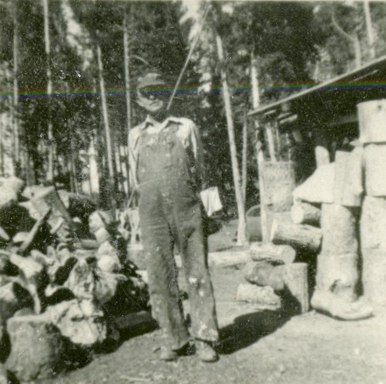 Fred Rowley on the back porch of the homestead.
