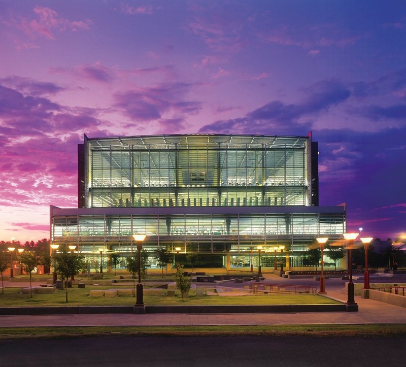 Beautiful front view of the Burton Barr Central Library at sunset. 