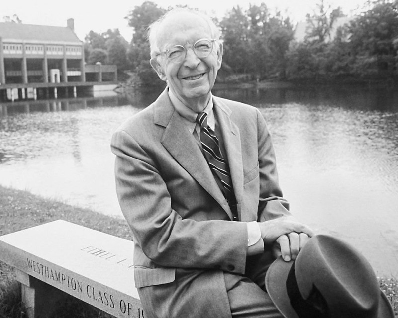 George Modlin posing next to Westhampton Lake. (Source: Pinterest, Professional & Continuing Studies - UR)