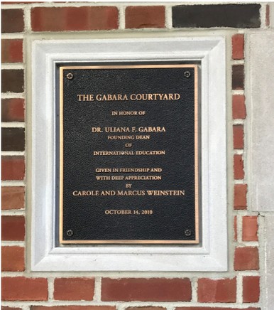 The plaque in the International Center Courtyard that dedicates the area to Dr. Gabara.