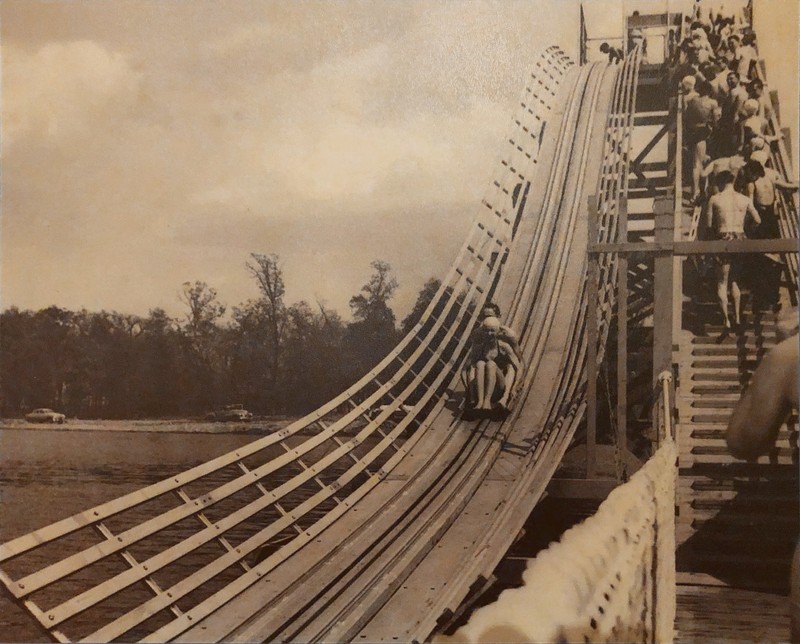 A couple comes barreling down the Lake of the Woods seaslide on a wooden sled!