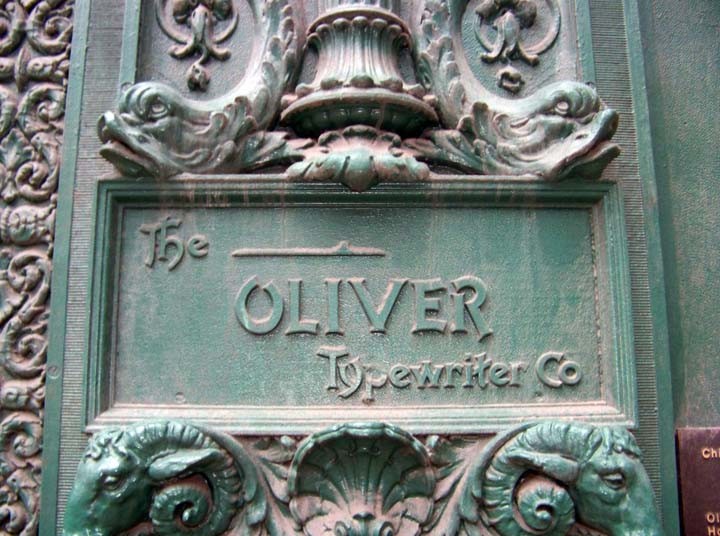 The nameplate that remains in place on the front facade, despite the building now existing as part of the James M. Nederlander Theatre