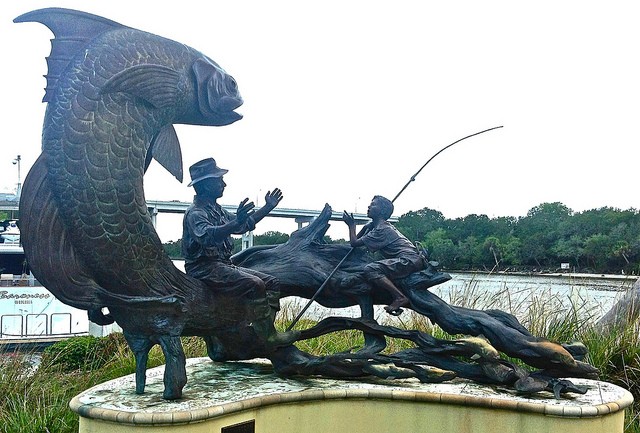 Bronze sculpture "Fish Story" by Paul Baliker. Now located on Mariners Hospital's campus. Credit: Readerwalker, Flickr