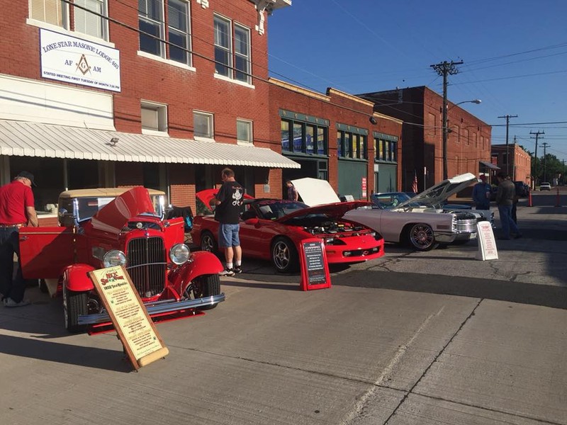 Car show hosted by the lodge on May 5th, 2018. Located on S Fannin St. The lodge is behind the cars with a white sign attached to the front.