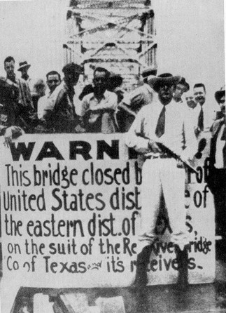 A Texas Ranger stands guard at the Denison-Durant free bridge with a sign which explains the reason for the bridge's closing. Reportedly, this image was featured in Time Magazine, showing that the controversy received popular attention.