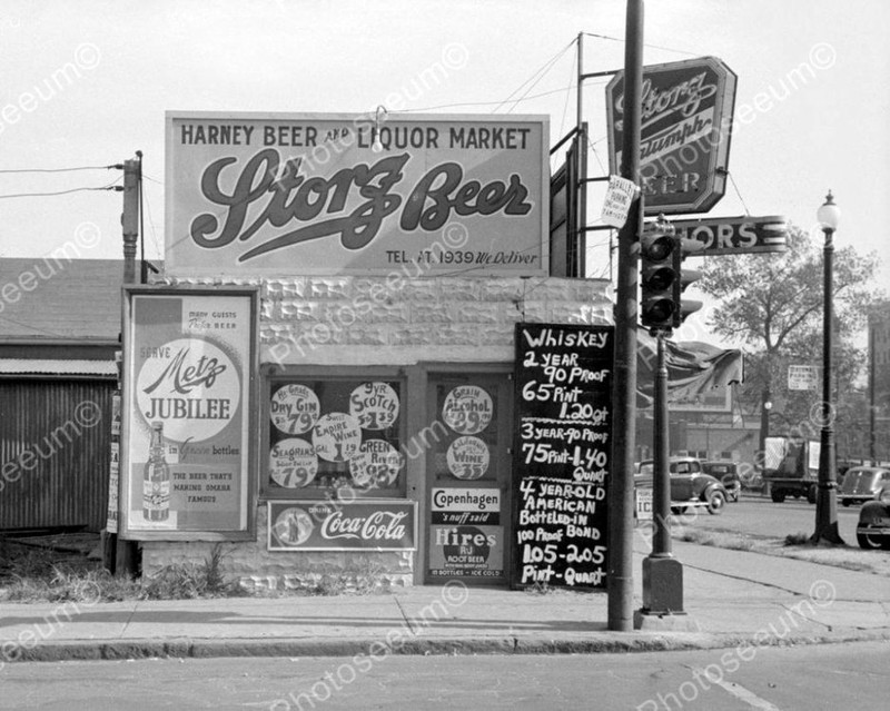 Storz beer being advertised by a liquor store on Harney Street in Omaha, Nebraska with a large outdoor signage, 1938