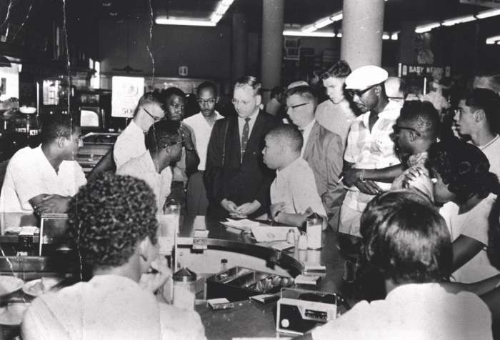 Photo Credit: Provided by Rodney Hurst: "Rodney Hurst (center right), who was 16 at the time, sits at the Woolworth's counter in August 1960. "