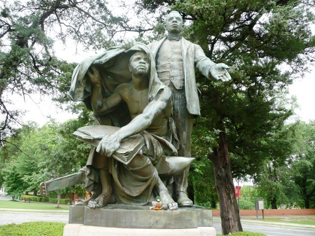 "Lifting the Veil of Ignorance" was created by Charles Keck in 1922 to honor the life of Booker T. Washington.