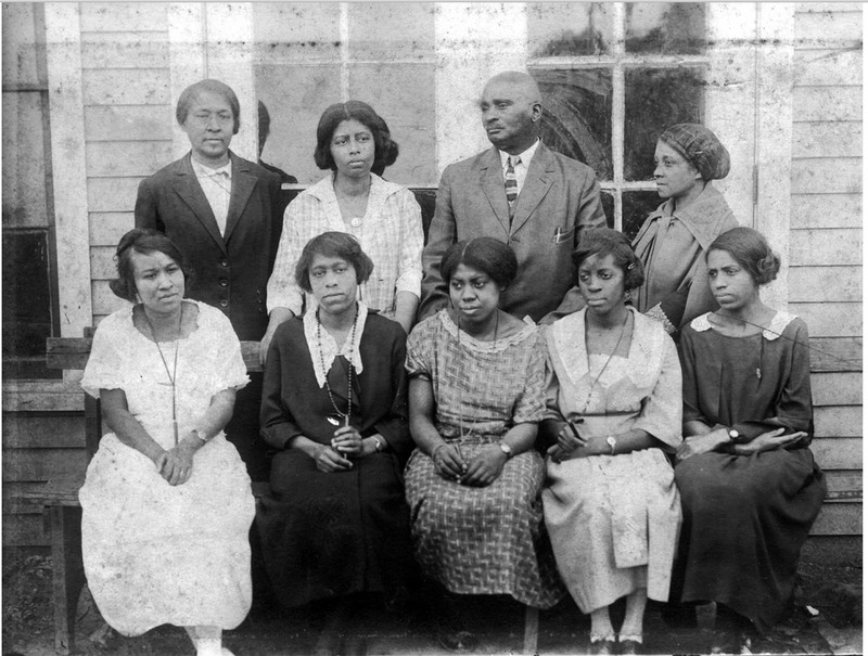 1921 Franklin Training School Principal and Teachers. Standing, Left to Right, Carrie Otey, Edna Hughes, J.K. Hughes (Principal), Julie Williams, sitting: Irene Williams, Mattie Stewart, Patty Carter, Patti Davis, Carrie L. Ridley.